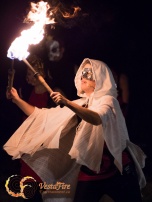 Fire performer dances with fire